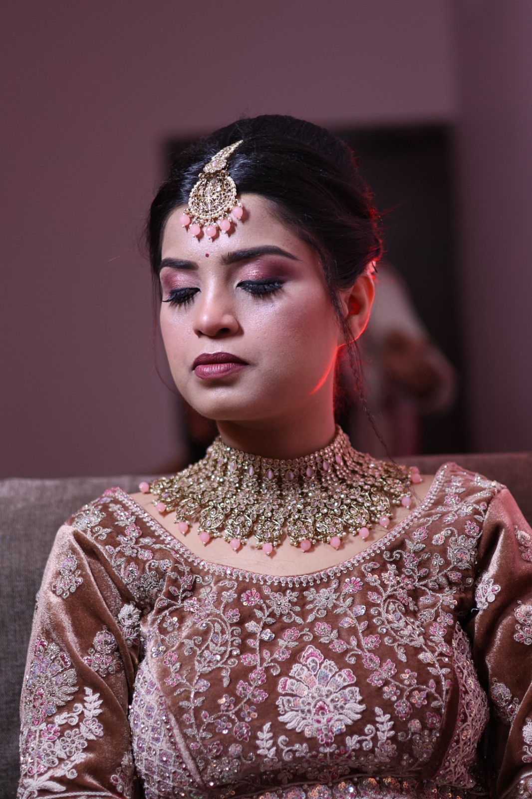 Romantic couple exchanging rings during their engagement, captured by DesignInfo Photography.